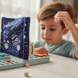 The blue space themed bag from the PlanToys Guess my Planet game used as the barrier in the middle of the board base. 