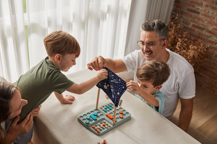 tipped over on a white background with the game pieces scattered around