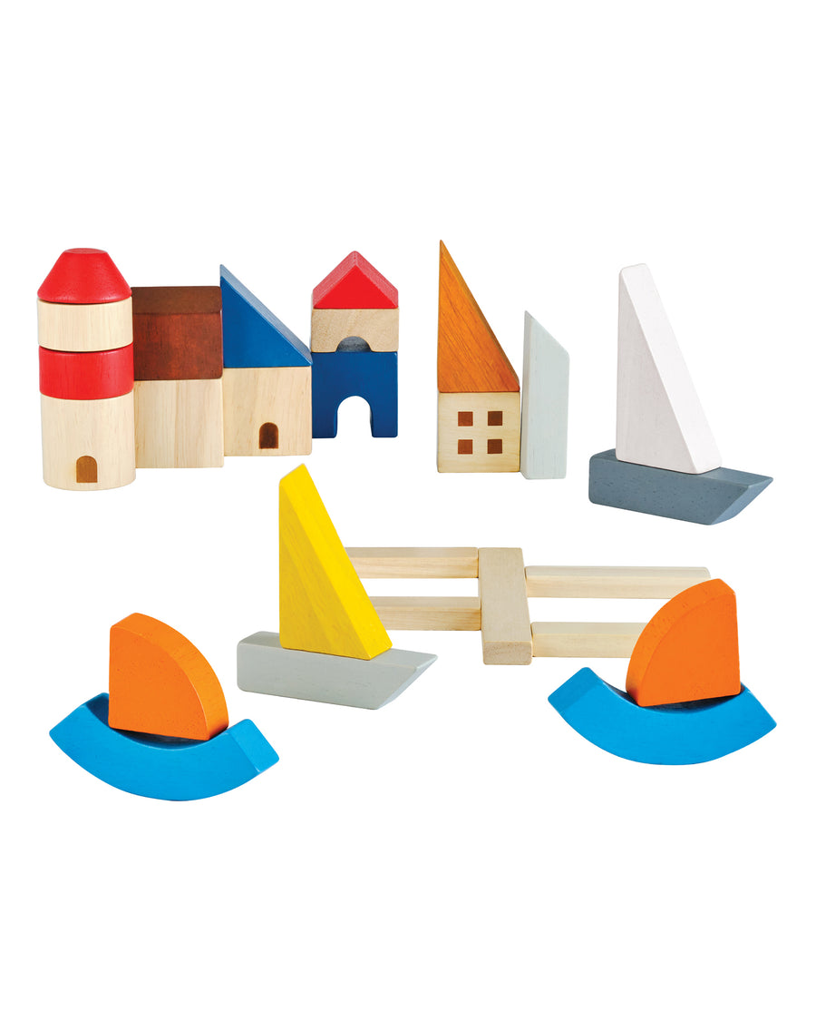 The PlanToys Marina Blocks. A set of 27 wooden blocks including decks, sail boats, port city and lighthouse for creative, open-ended play