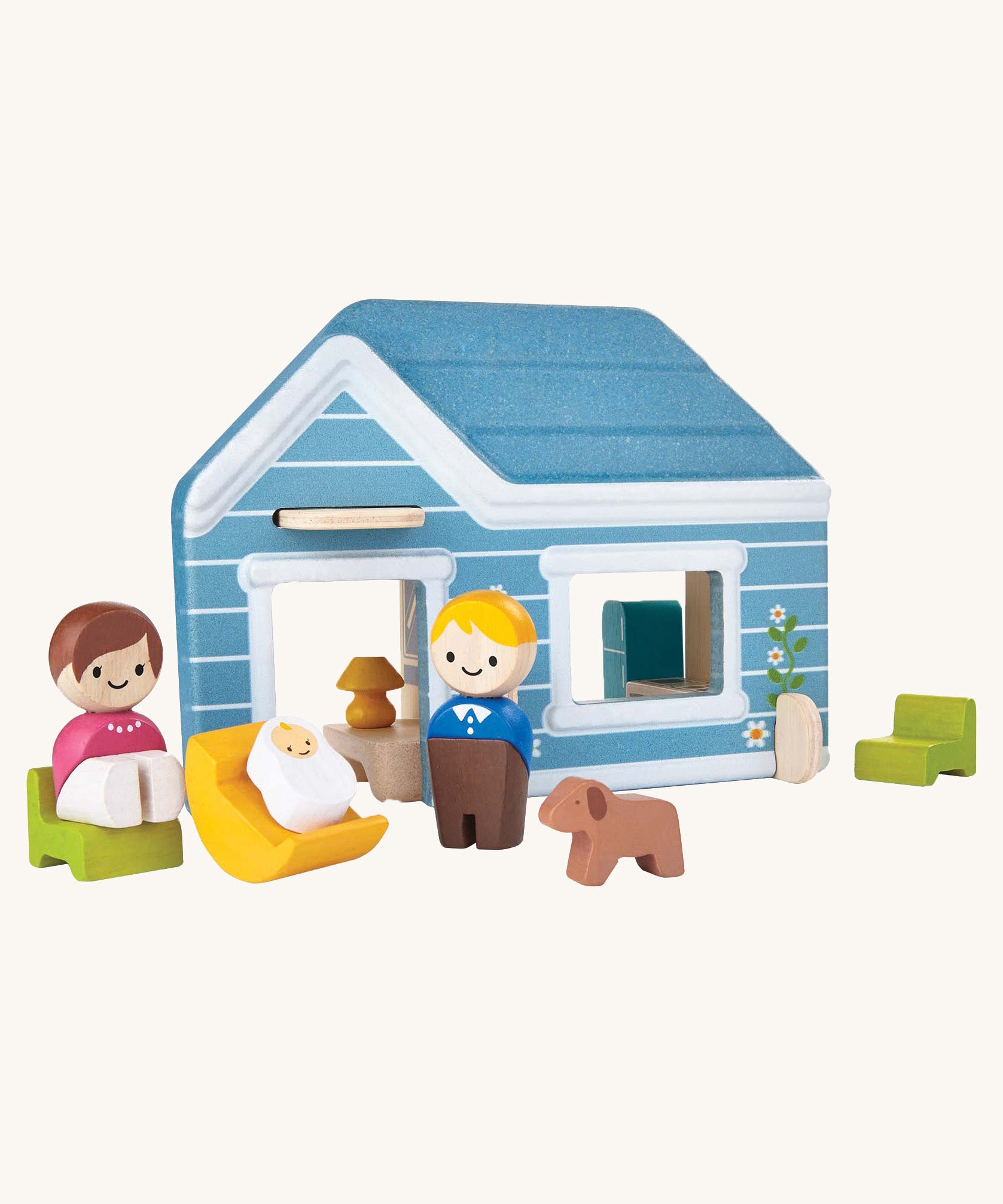 The PlanToys mini home set with both parent peg dolls, their baby in a little wooden crib, and their dog.