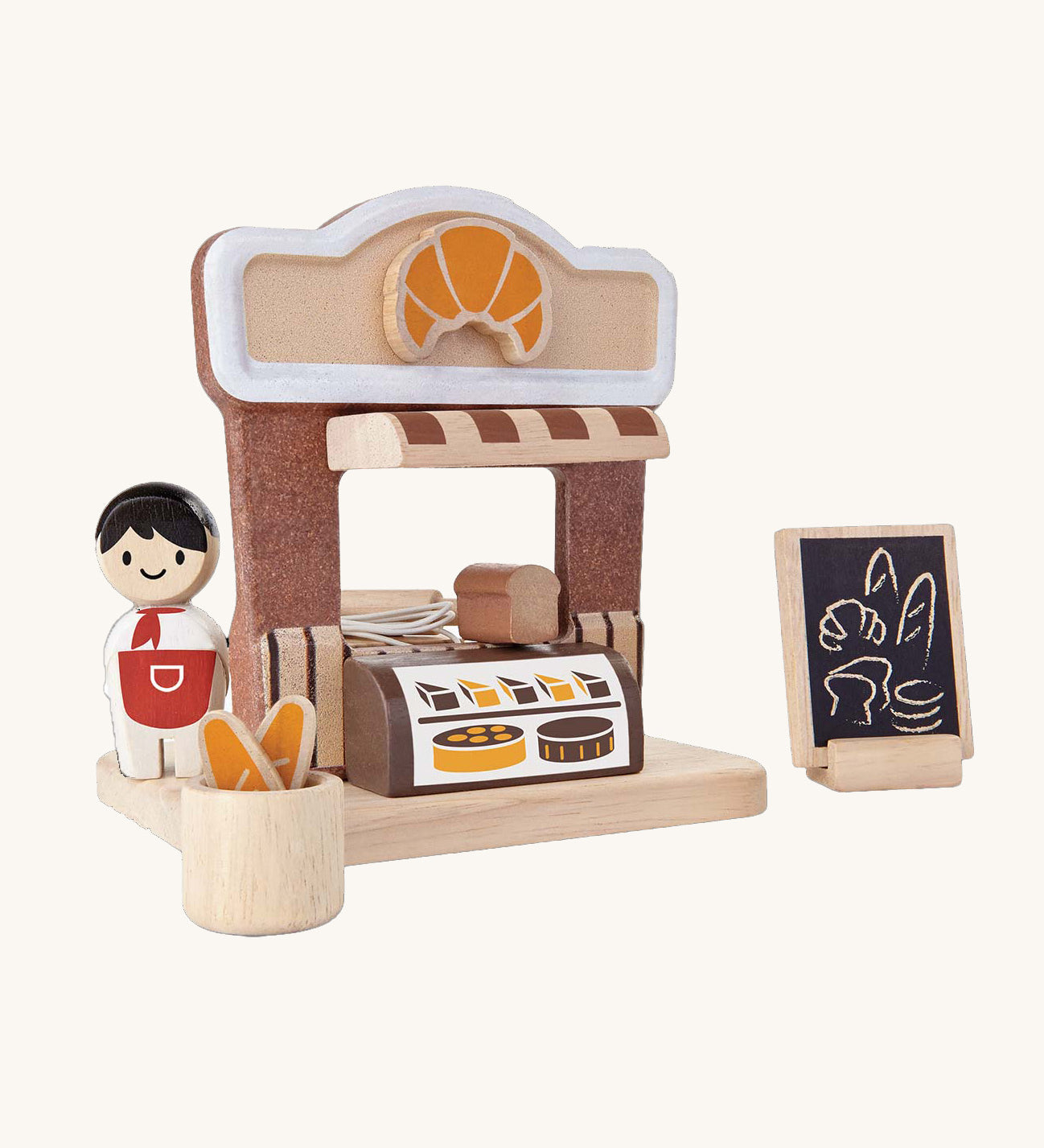 The PlanToys wooden bakery play set, with a mini Baker peg doll.