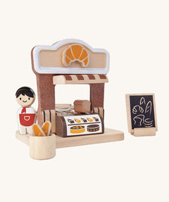 The PlanToys wooden bakery play set, with a mini Baker peg doll.