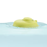 Close up of a PlanToys plastic-free natural rubber submarine toy floating in some water