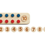 Close up of the PlanToys wooden numbers peg board game on a white background