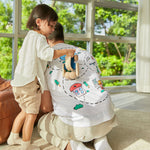 Man kneeling down with a child pushing the PlanToys wooden sensory roller vehicle toy across his back