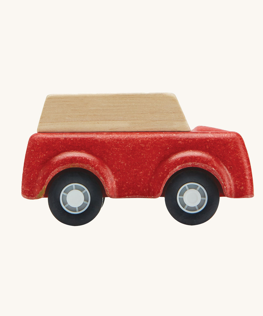 A side view of the PlanToys Red SUV toy car on a plain background.