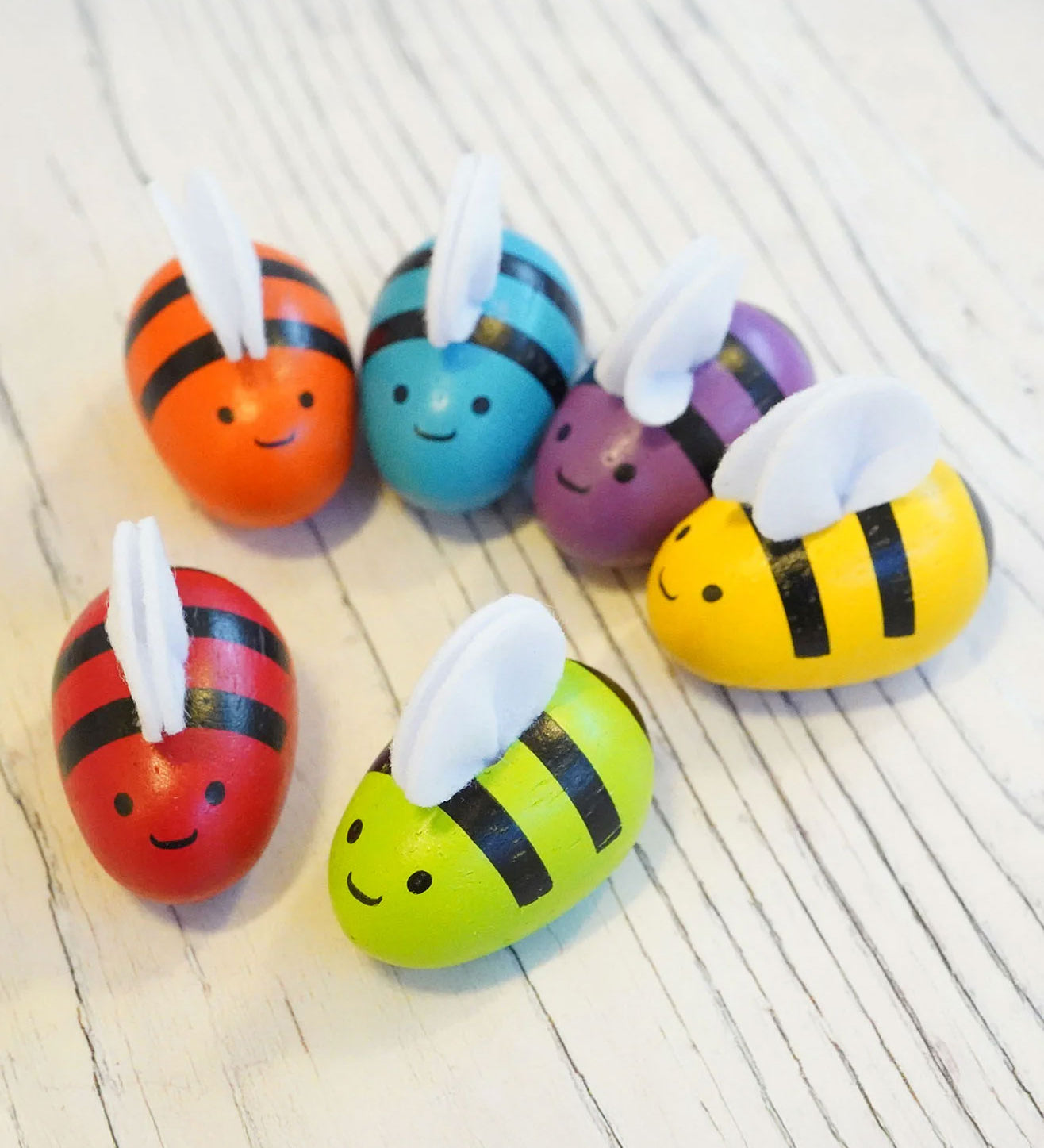 PlanToys Replacement Bees for bee hives in rainbow colours. 
