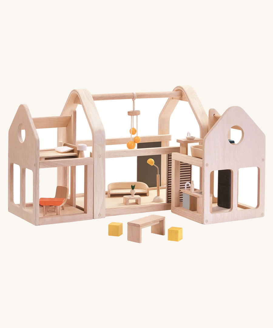 PlanToys Slide N Go Dolls' House on a plain background. 