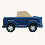 A side on view of the PlanToys Blue Truck on a plain background. 