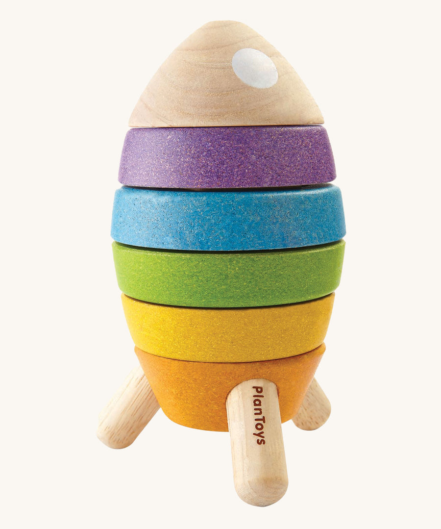 The PlanToys Stacking Rocket toy on a plain background. 
