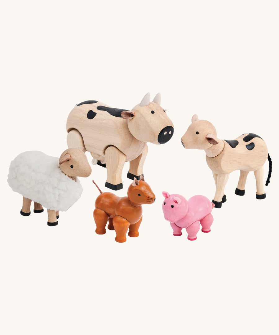 PlanToys Farm Animals Set on a plain background. 
