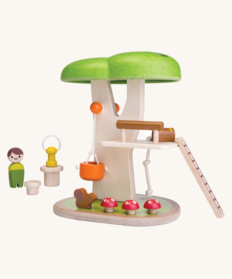 The PlanToys PlanWorld Tree House on a plain background. 
