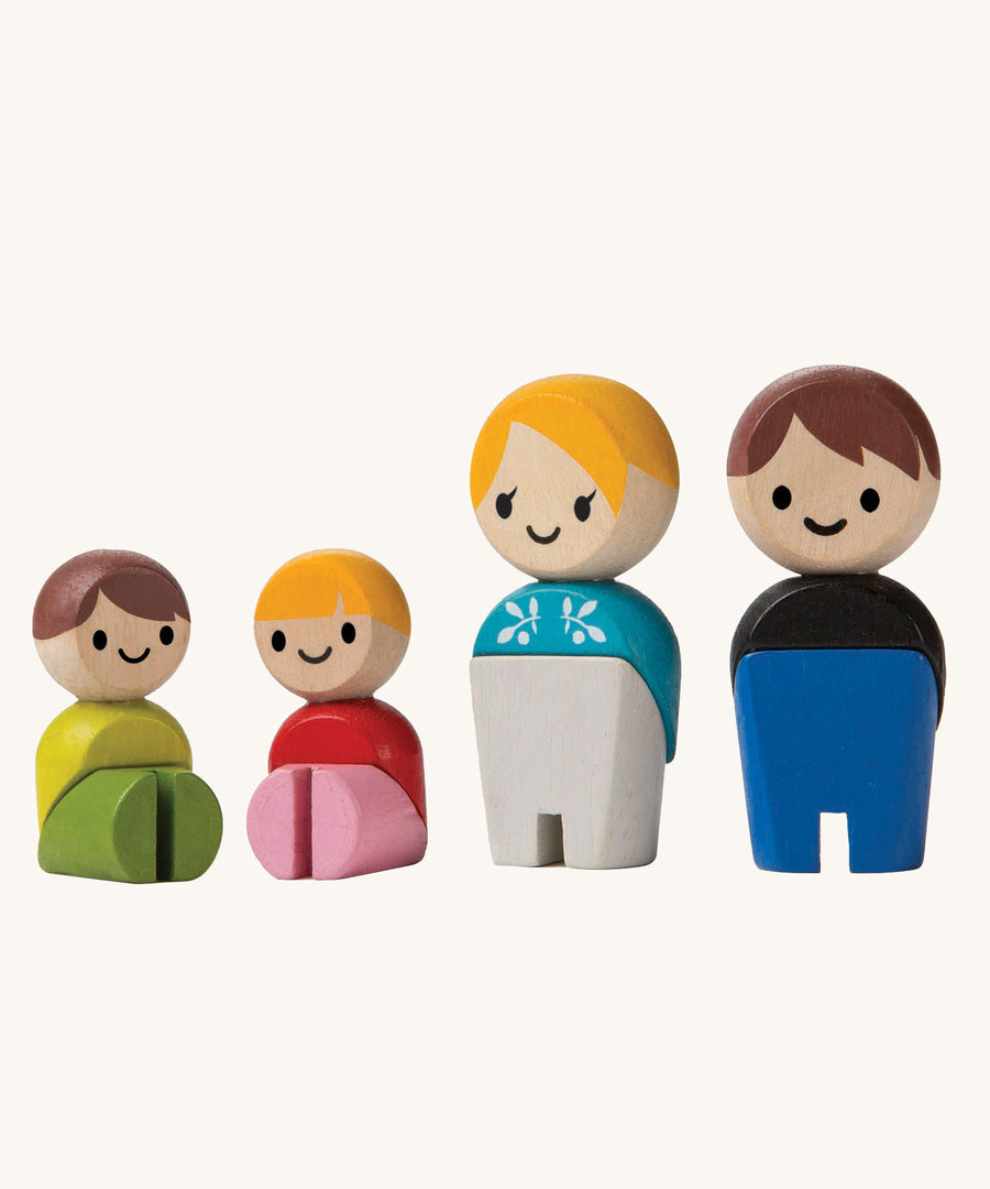 The PlanToys PlanWorld White Skin, Brown and Blonde Hair Family figures on a plain background. 
