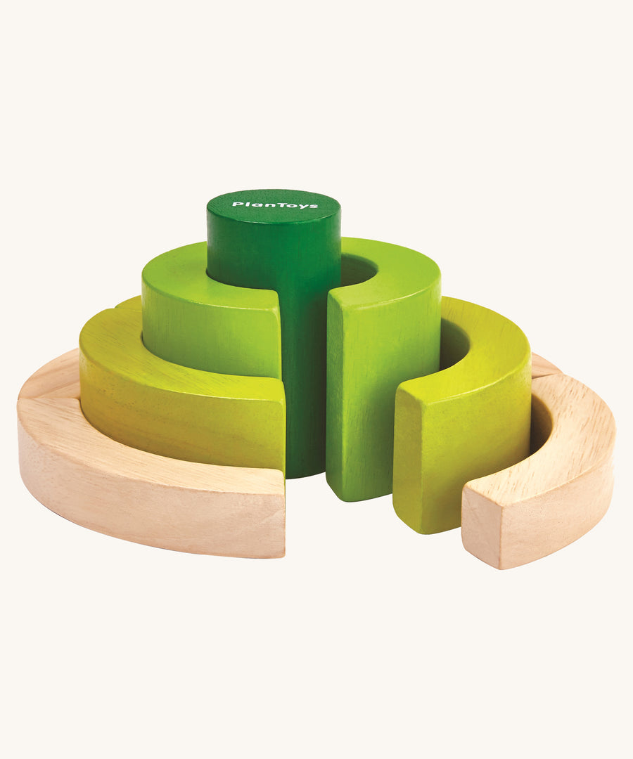 PlanToys Curve Blocks on a plain background. The blocks are pictured out of their packaging. 