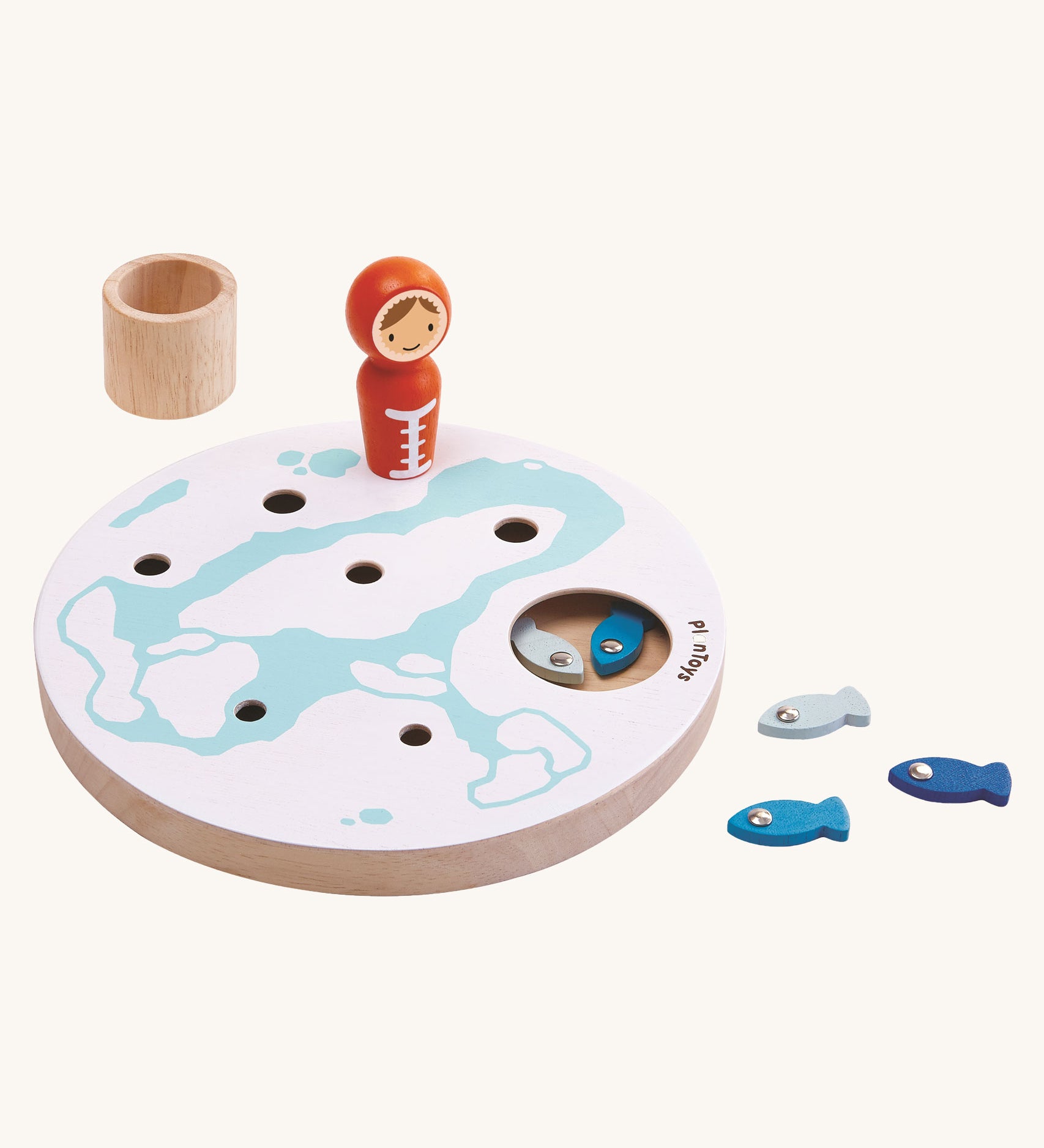 PlanToys Ice Fishing Game on a plain background. Some of the fish can be seen inside the base and some by the side of the base.