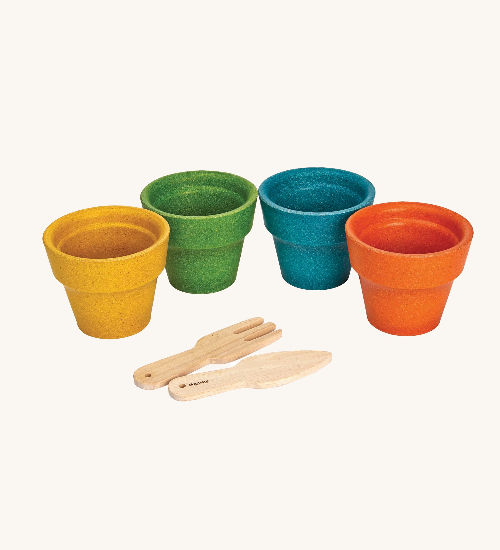 The PlanToys wooden flower pots on a plain background. 