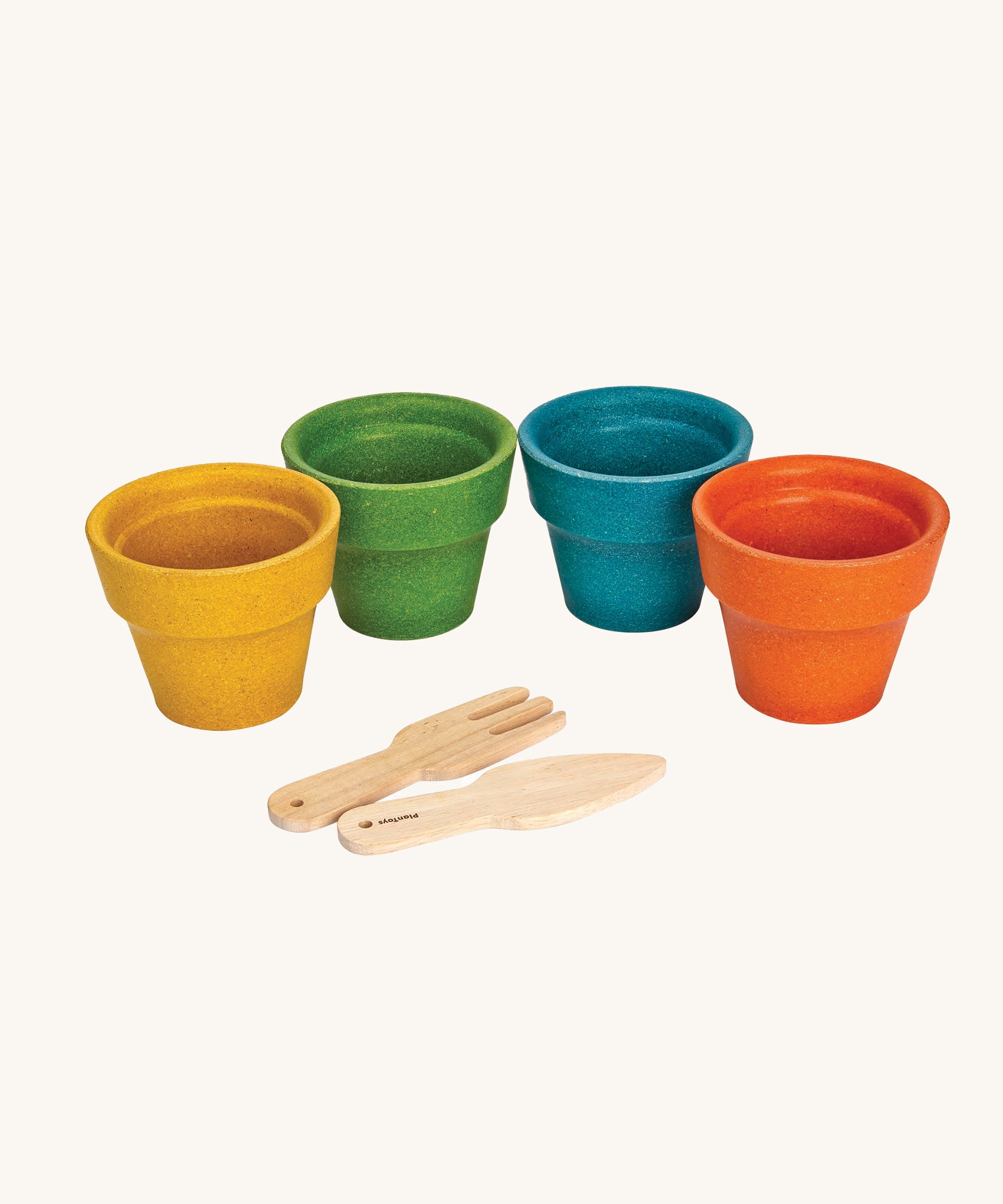 The PlanToys wooden flower pots on a plain background. 