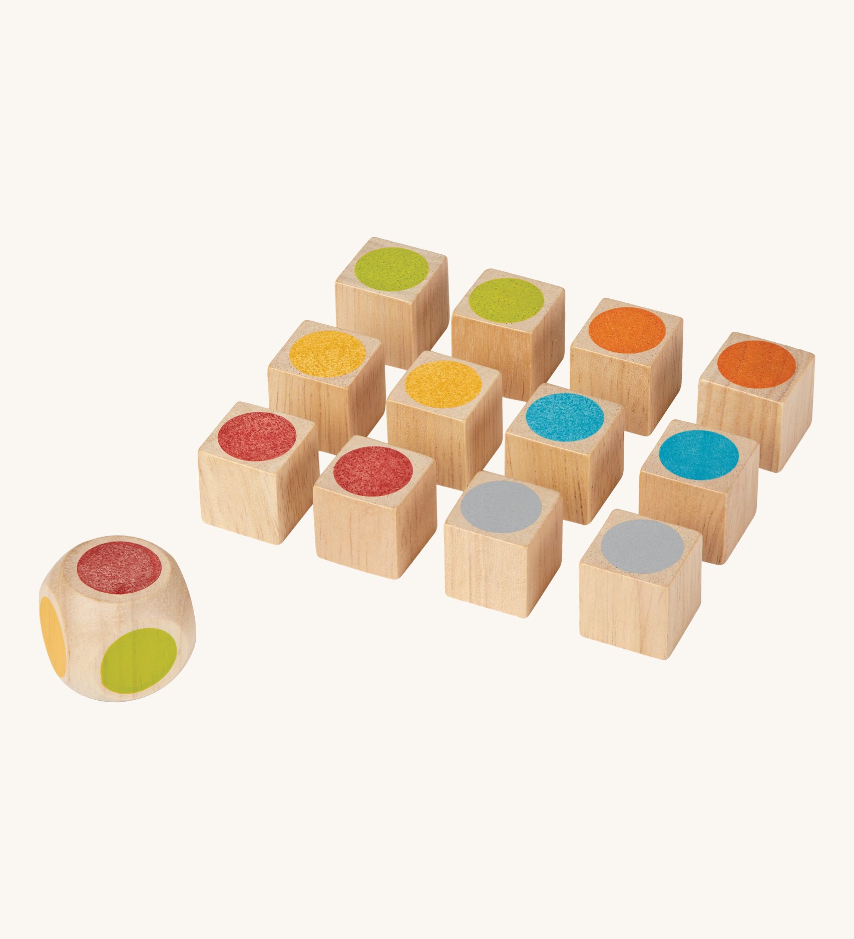 The PlanToys Mini Memo Game on a plain background. The pieces are all showing the coloured sides of the cubes. 
