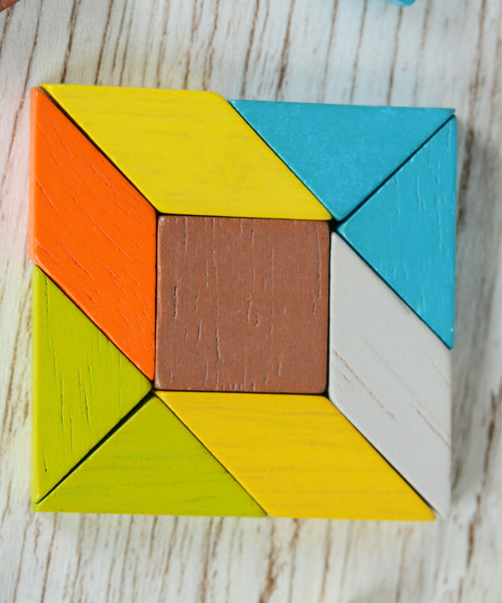 A square created using the pieces from the PlanToys mini mosaic Set.
