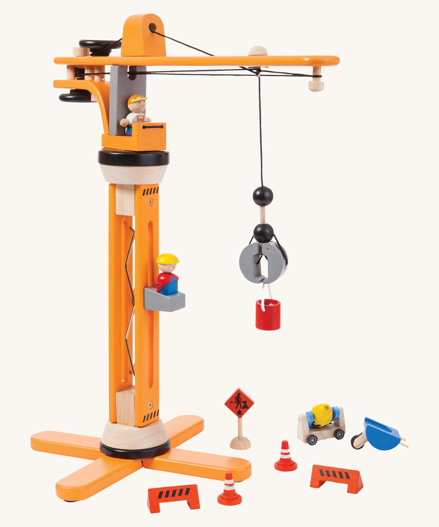 The PlanToys PlanWorld Crane Set  on a plain background. 
