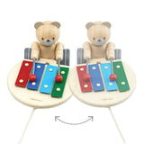 2 PlanToys musical xylophone bear toys on a white background showing how the bear plays different notes when you steer