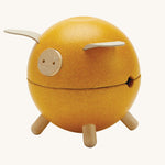 The PlanToys Yellow Piggy Bank on a blank background.
