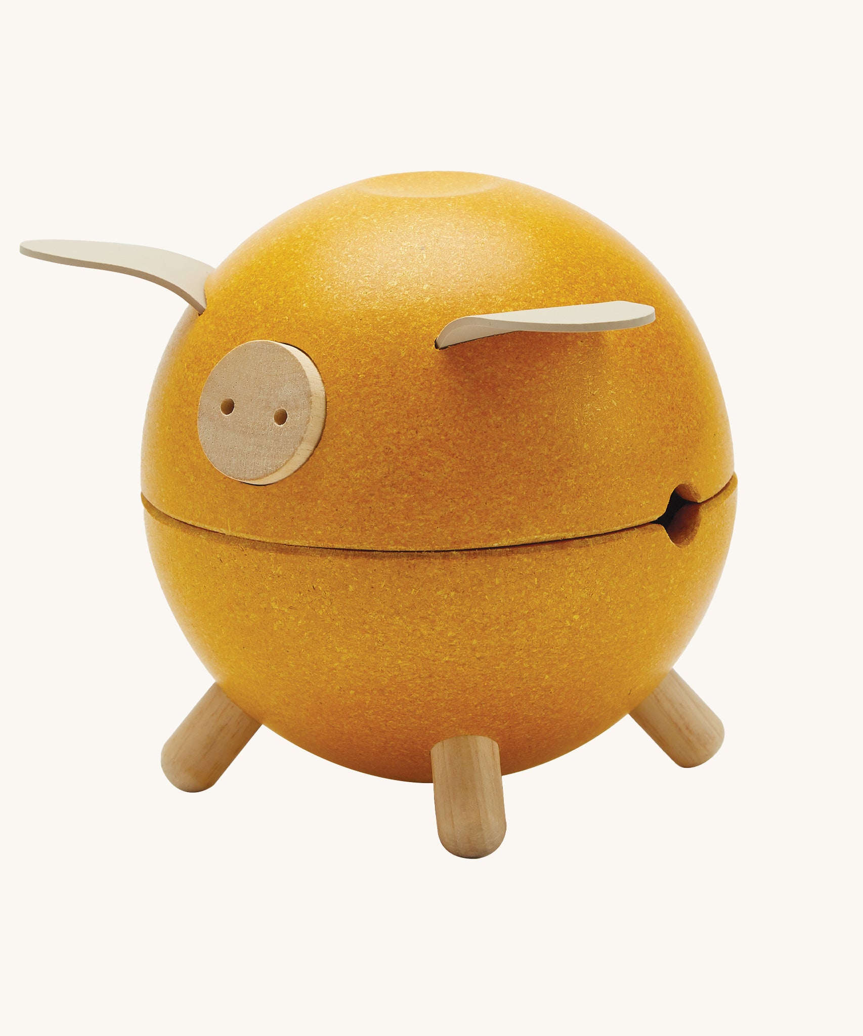 The PlanToys Yellow Piggy Bank on a blank background.
