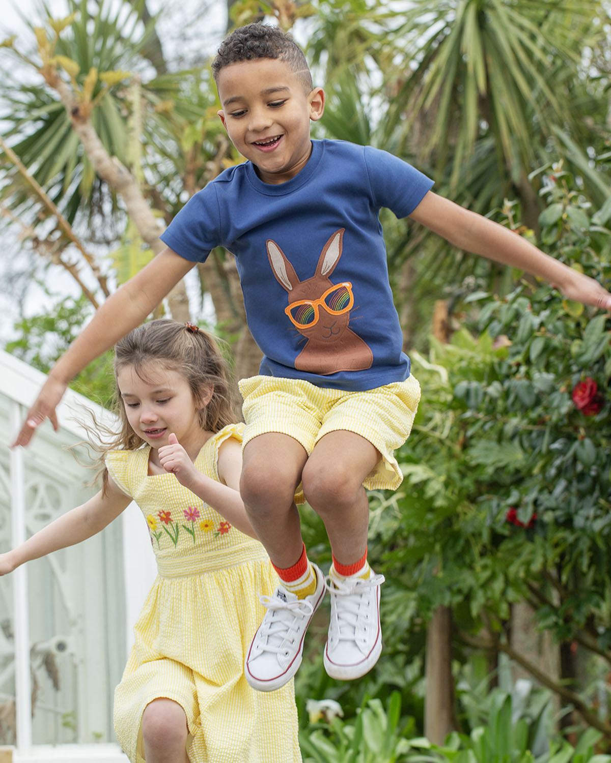 A closer view of the yellow draw string and waist band of the Frugi Archie Seersucker Shorts - Dandelion. A bright yellow and white striped short