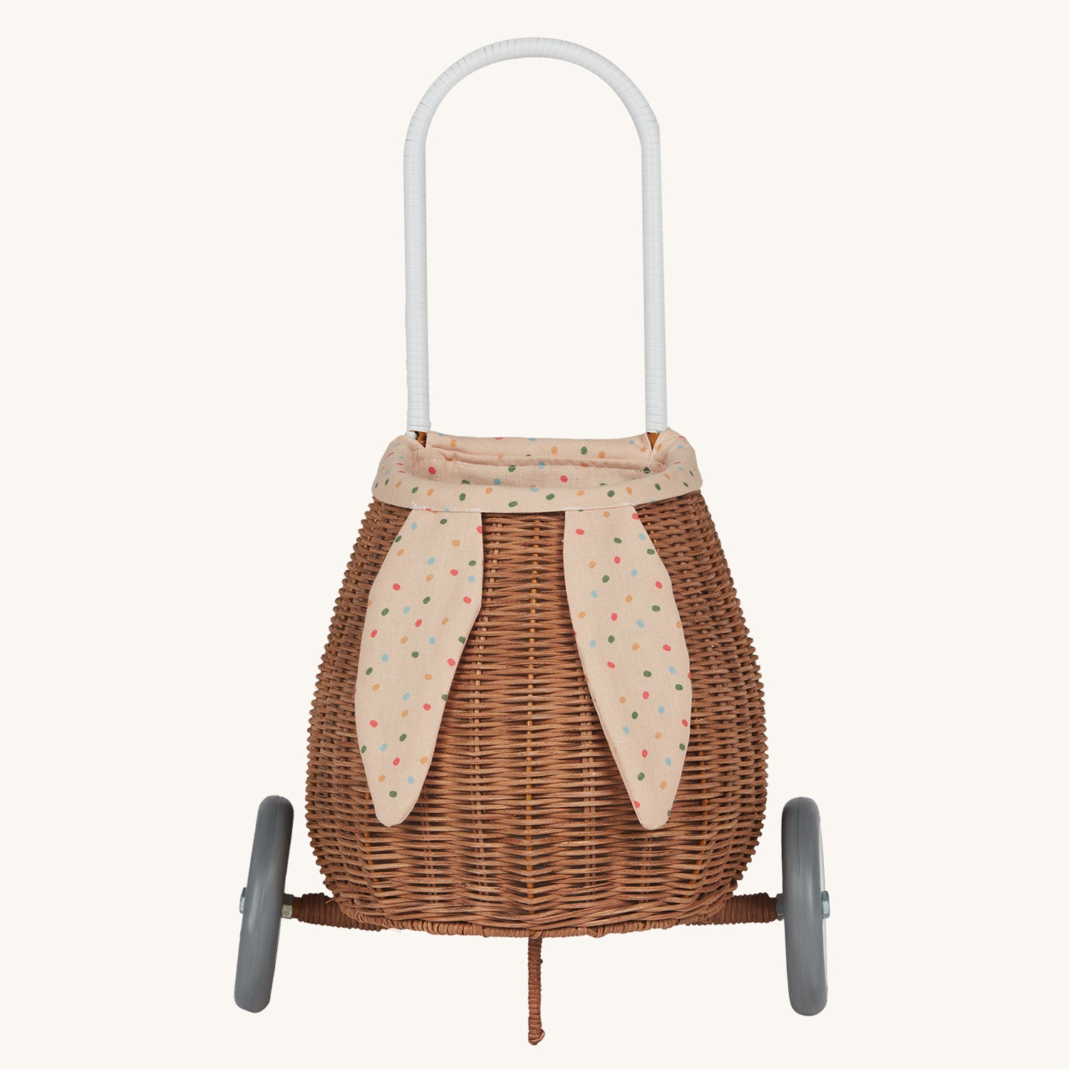 Olli Ella Rattan Bunny Luggy with Lining – Gumdrop. A beautifully woven Luggy roll along basket with a light peach lining and gum drop detail