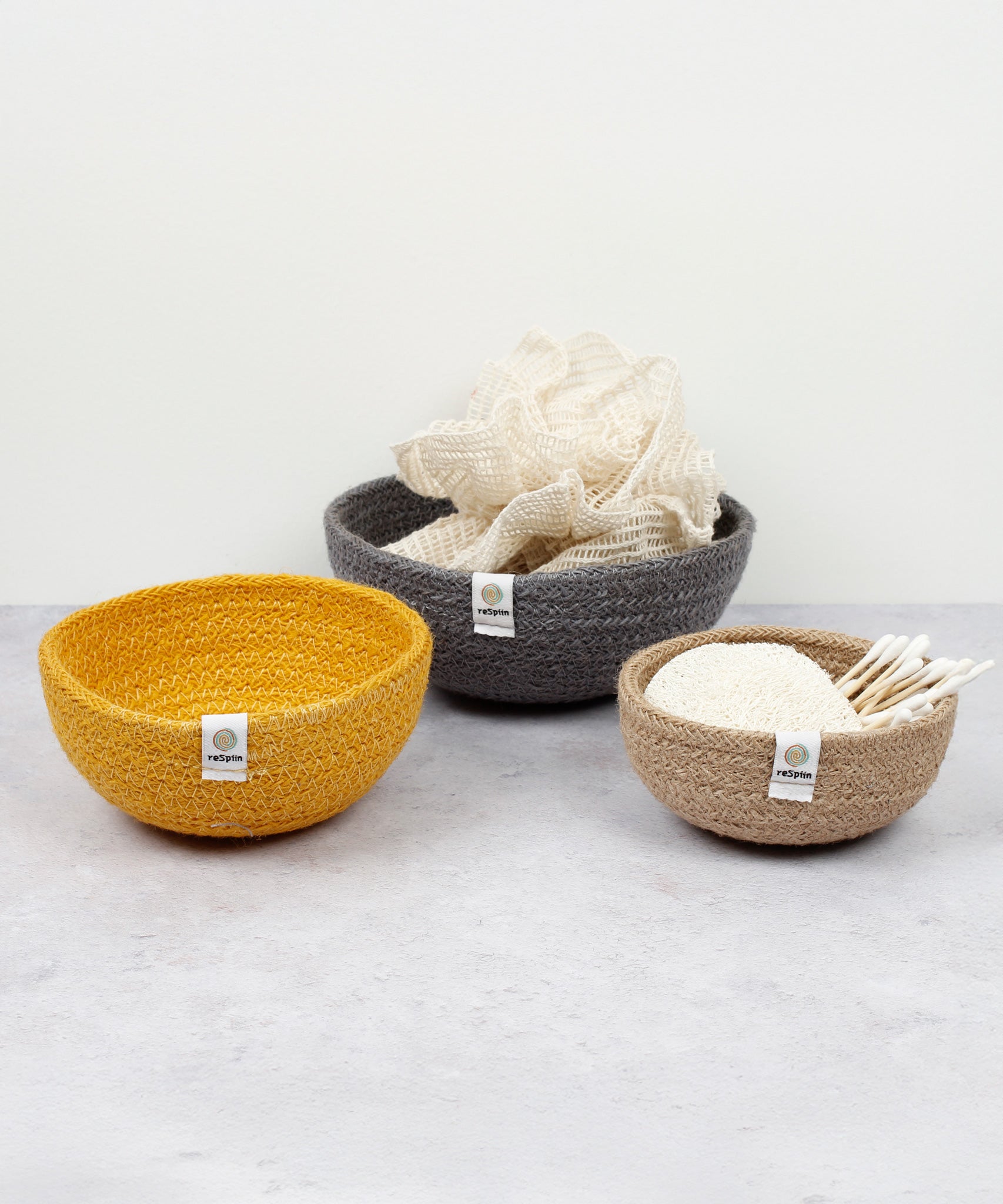 ReSpiin Jute Mini Bowl Set in the mixed beach colourway with bathroom items inside them