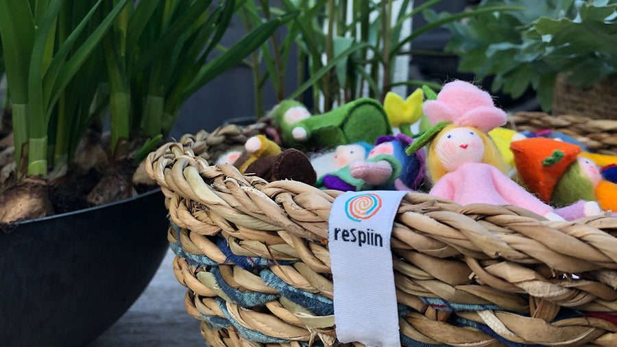 ReSpiin handmade jute basket closeup with felt fairies inside. 