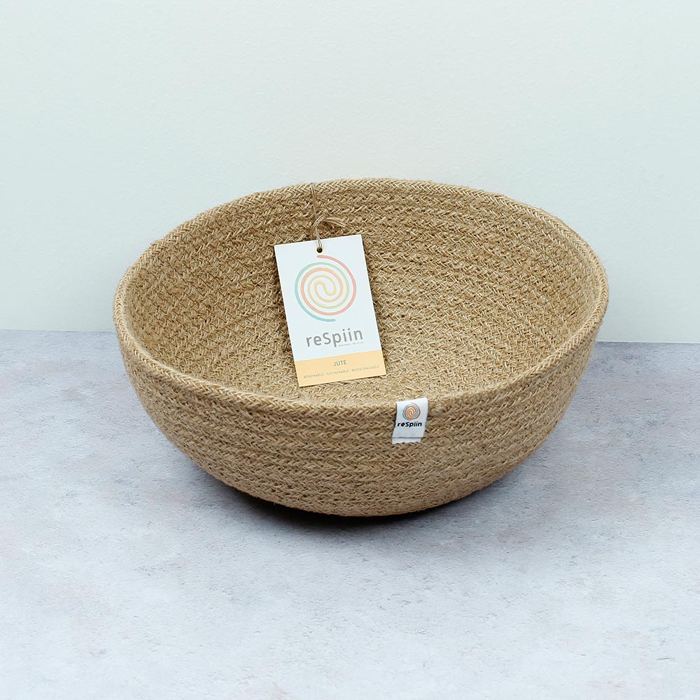 ReSpiin Jute Natural Large woven Bowl with white respiin label on aa grey surface