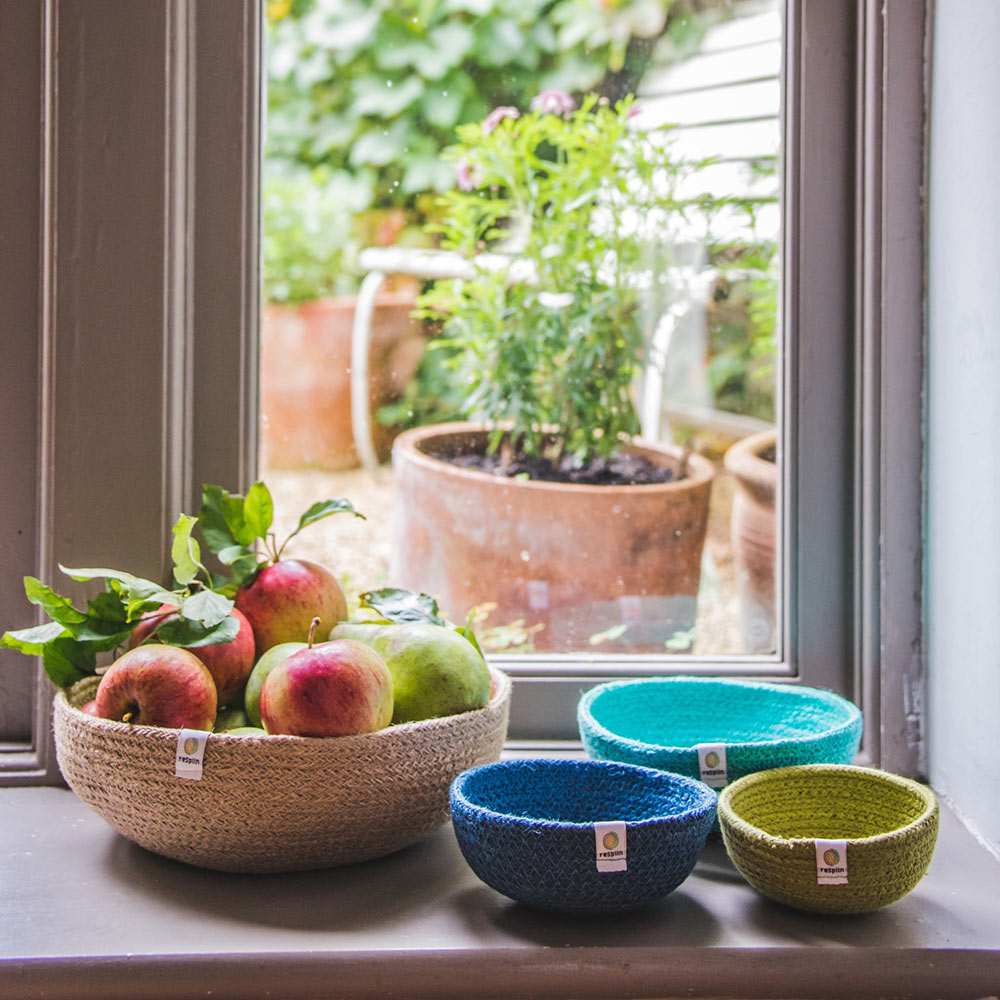 ReSpiin Jute Multicoloured Mini Bowl Set of 3 in the ocean colourway on a windowsill next to a large just basket