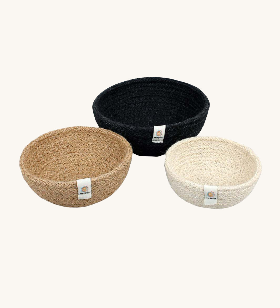 Respiin set of 3 natural mini bowls in natural, cream and black colour on a cream background.