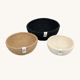 Respiin set of 3 natural mini bowls in natural, cream and black colour on a cream background.