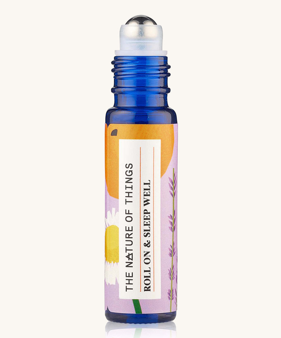 Roll On Sleep Well Essential Oil Blend a blue galss bottle showing roll-on applicator.