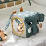 The Roommate Jungle animals soft Baby Activity Cube toy showing the side with the elephant face and the side with the mirror.