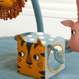 The Roommate Jungle animals soft Baby Activity Cube toy showing the side with the tiger face and the side with the mirror.