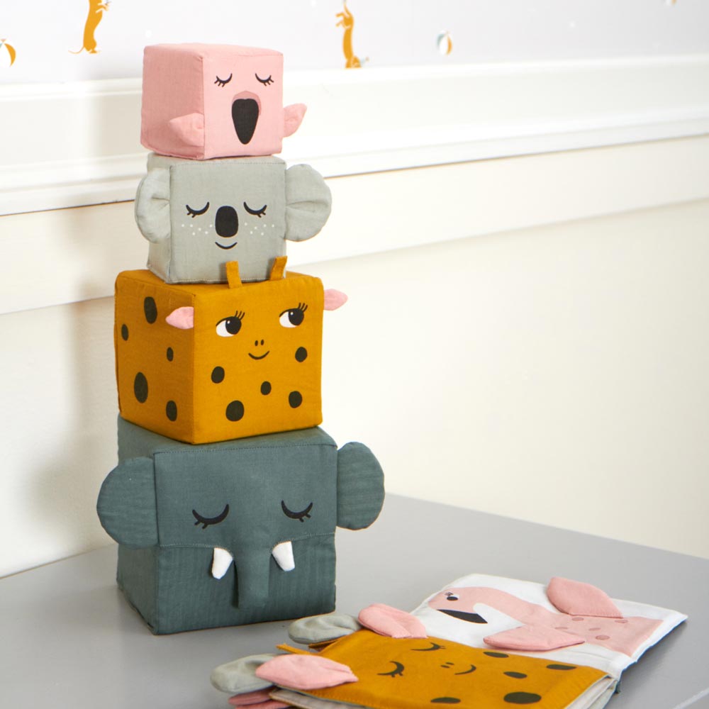 The Roommate Jungle Life Stacking Blocks shown stacked on a grey coloured surface. 