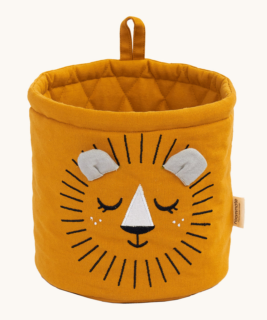 The Roommate Mini Quilted Basket - Lion in mustard yellow, with a sleepy embroidered face, and two small fabric ears in grey, and a mustard yellow hanging loop