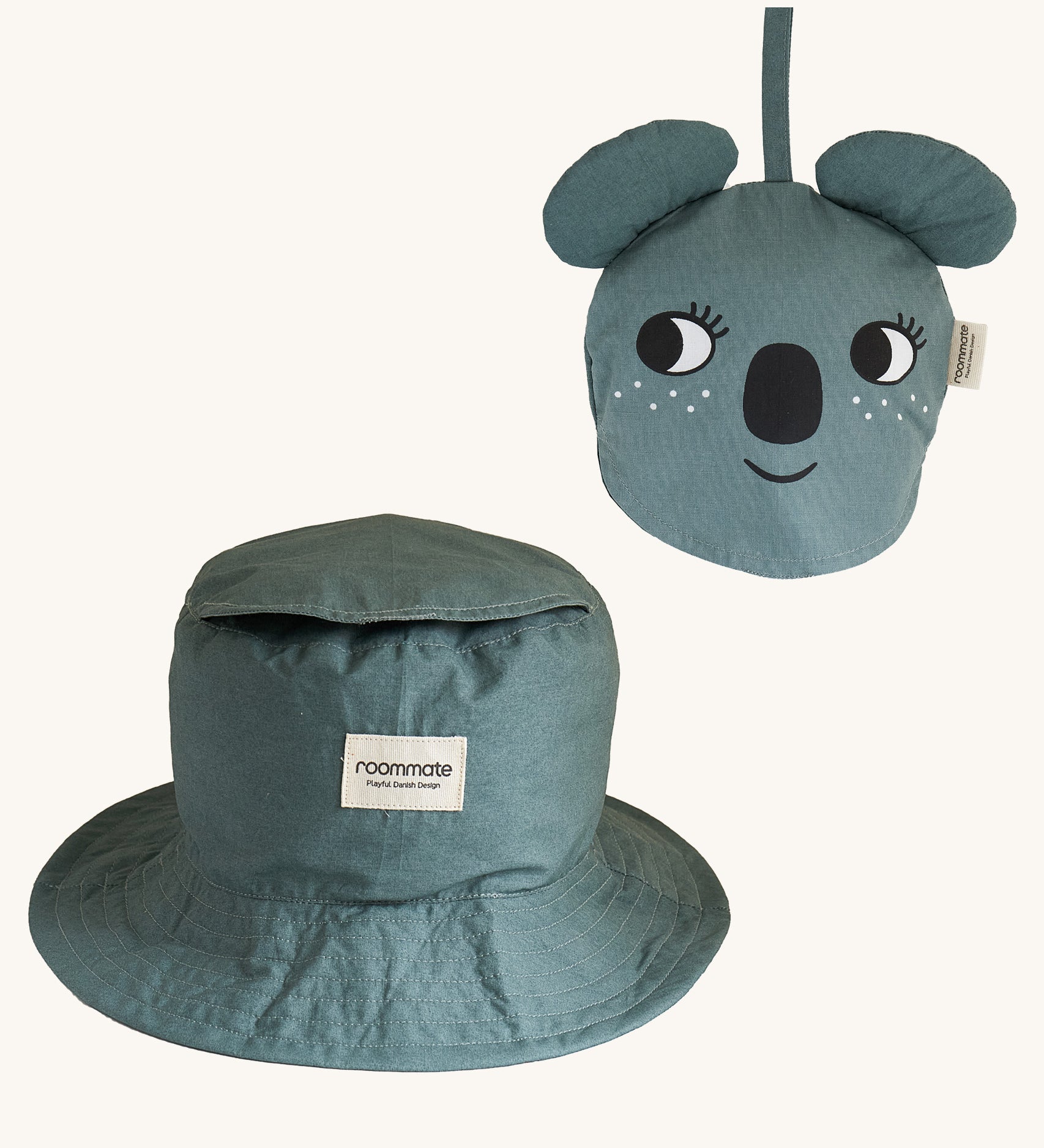 Two Roommate Koala bucket hats, one is opened up into the bucket hat form, and another is folded into itself to create a koala face. 