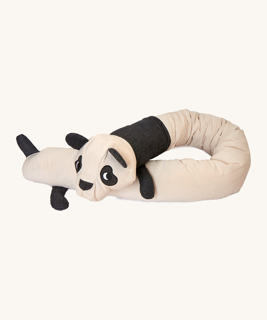 A long Roommate panda cusion lied flat on a cream background