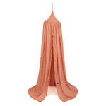 Roommate organic cotton rose canopy tent with gold tassels hanging on a white background