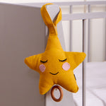 Roommate Star Lullaby Music Mobile hung on the end of a cot. 