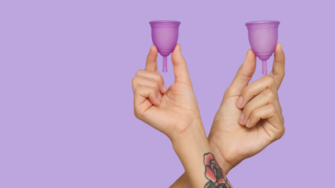 Two hands holding up purple Ruby Cups