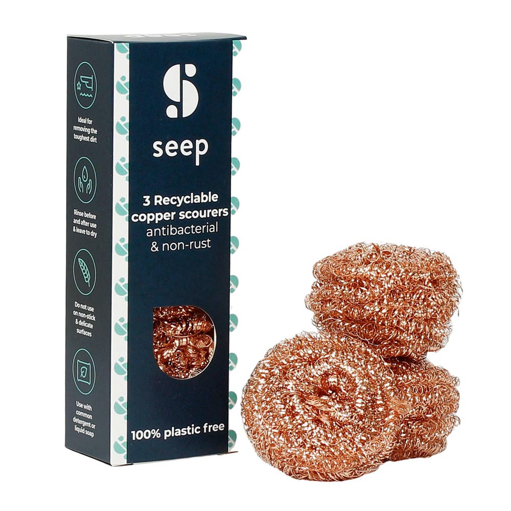 3 Seep reusable copper scourers on a white background next to their cardboard packaging