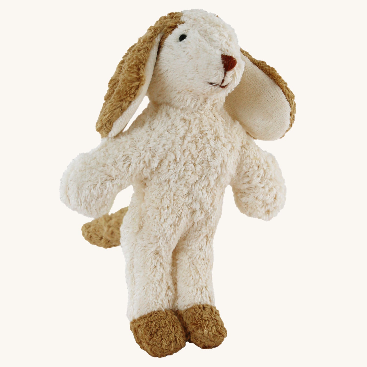 Senger Animal Baby Dog Toy. Made entirely of sustainably-produced cotton plush, and can safely be sucked or chewed, a soft body plush toy dog in light cream body and light brown ears, feet and tail, on a cream background