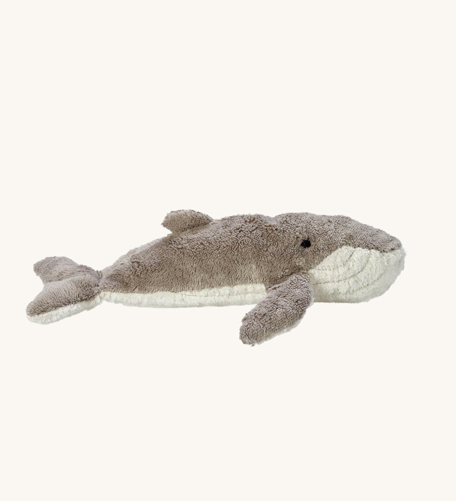 The Senger organic cotton cuddly whale stuffed animal toy, with a grey and white fluffy body.