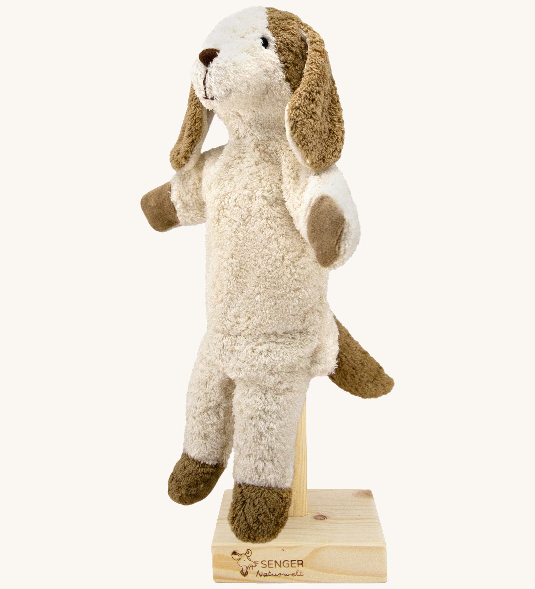 Senger Hand Puppet - Dog organic soft toy on a cream background.