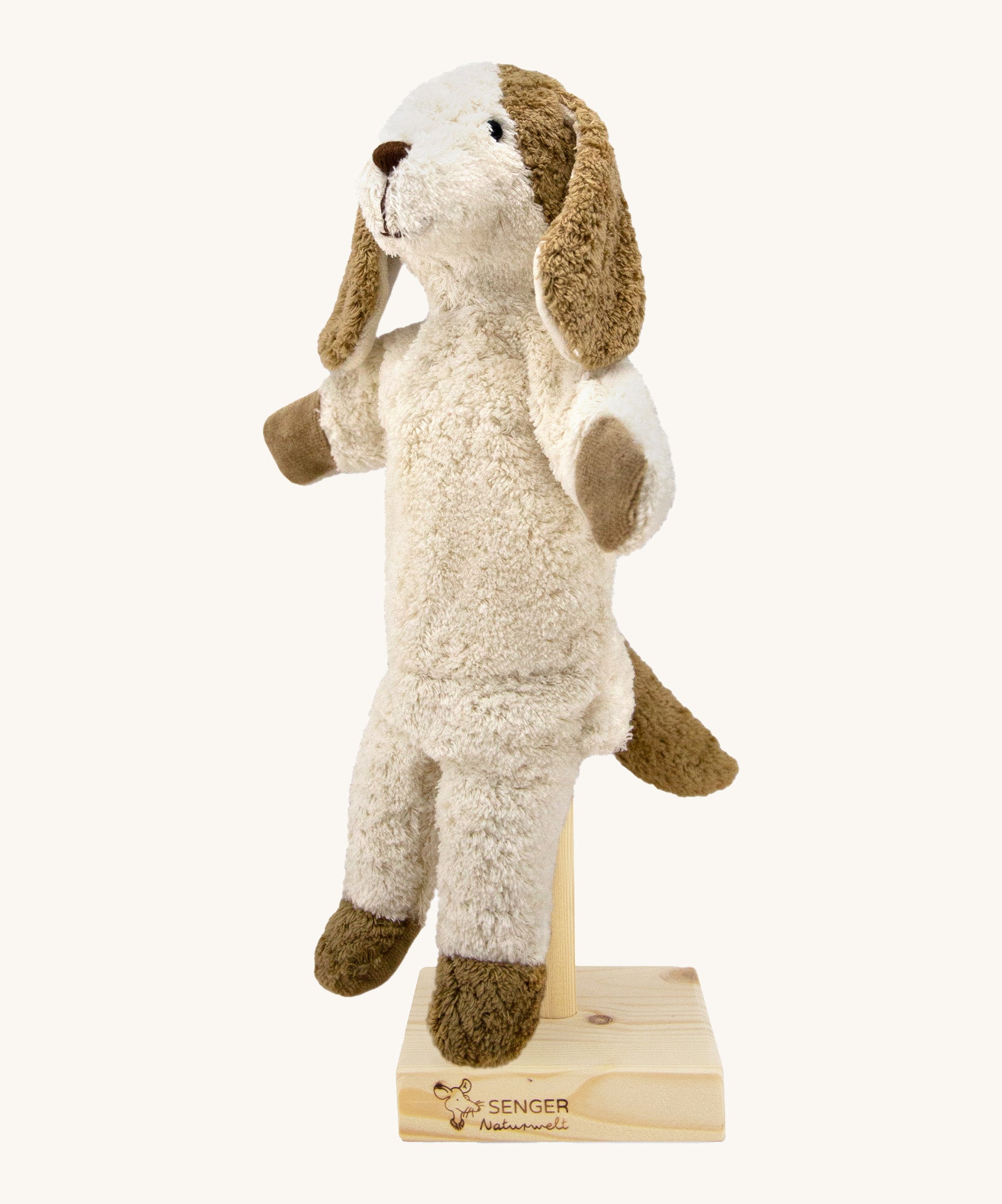 Senger Hand Puppet - Dog organic soft toy on a cream background.